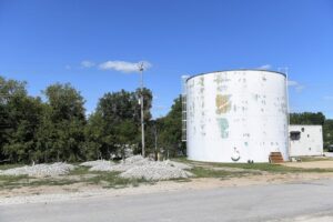 Trees planted next to a water tank at the former Gelman site in Ann Arbor, Michigan, September 7, 2022. The trees are part of dioxane remediation.  The EPA will begin sampling groundwater around the Gelman Plume in Ann Arbor later this month, a crucial step toward listing the polluted area as a Superfund site.